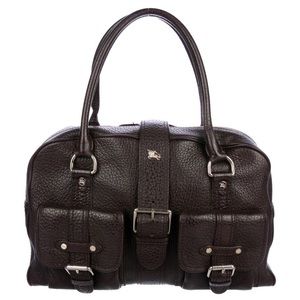 Burberry black pebbled leather buckle purse. Gold toned hardware and dust bag